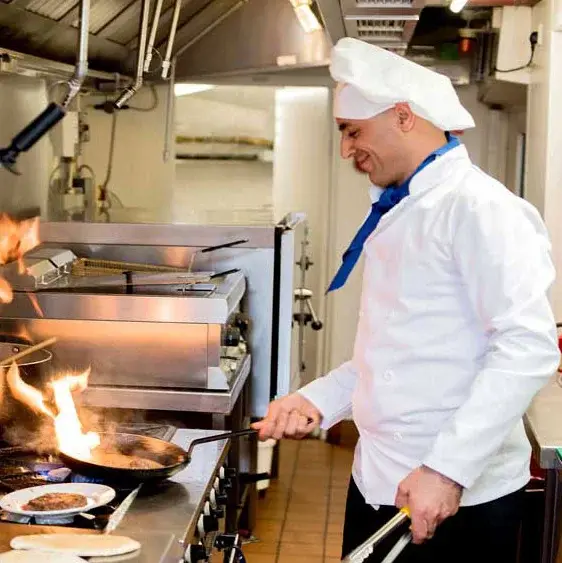 Glenmoore Chef Created Meals, chef frying a dish.