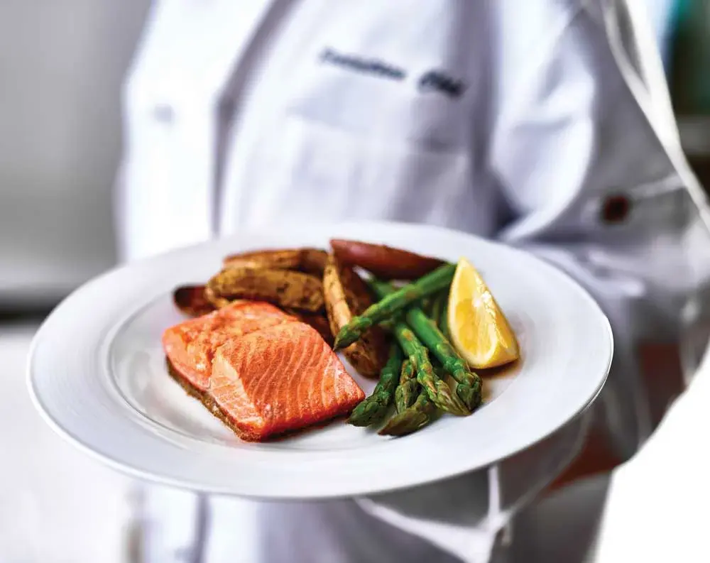 Glenmoore Chef Created Meals, chef delivering a finished dish.